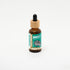 Amber glass bottle of Impact Botanicals Energize Face Serum with bamboo dropper top on white background.