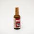 Nourishe Hair Serum by Impact Botanicals in amber bottle with bamboo cap.