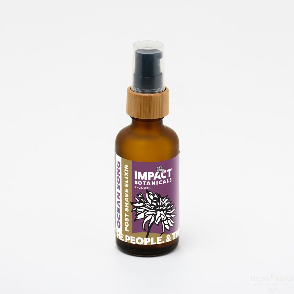 Amber glass bottle of Ocean Song Post Shave Elixir by Impact Botanicals with black pump top and bamboo detail.