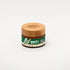 Amber jar of Impact Botanicals Relief Skin Cream with a bamboo lid.