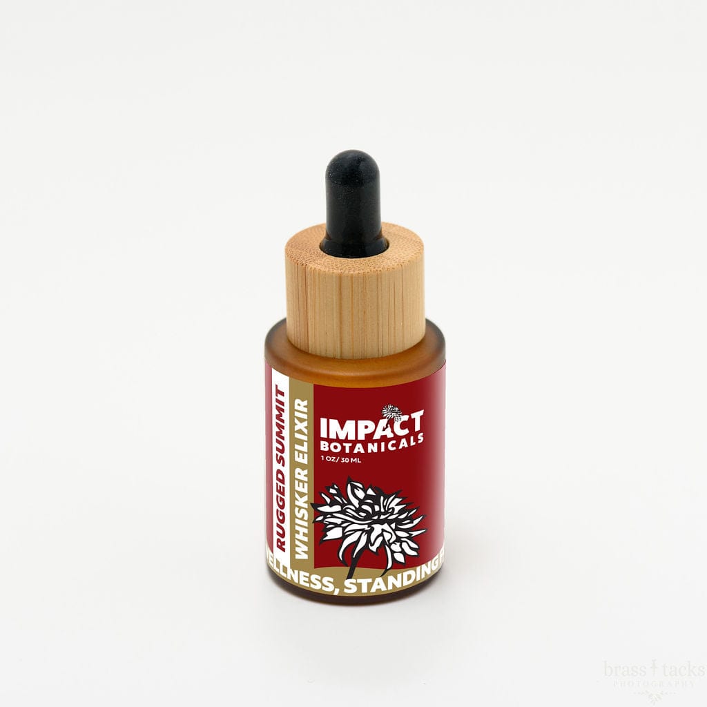 Amber glass bottle of Impact Botanicals Rugged Summit Whisker Elixir with a bamboo dropper top.