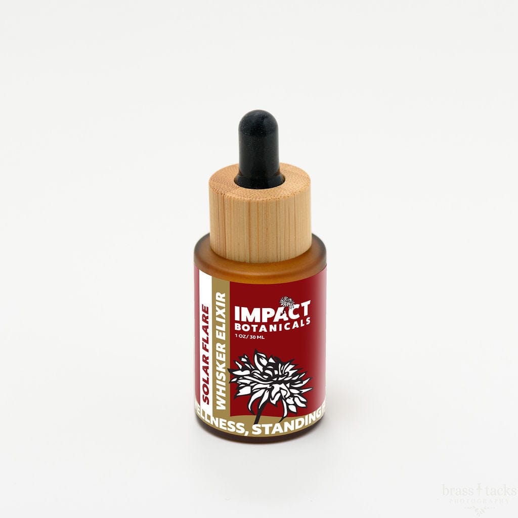 An amber glass bottle of Impact Botanicals Solar Flare Whisker Elixir with a bamboo dropper top sits on a white background.